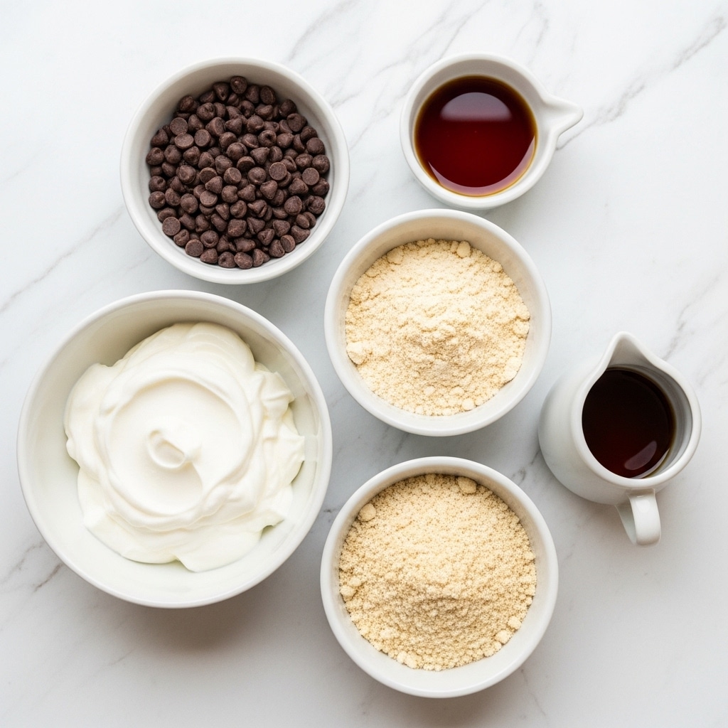 The image shows six white bowls and small containers arranged on a white marbled surface, each holding different ingredients. Starting from the top left, there is a white bowl filled with small dark brown chocolate chips. To the right, a small white bowl contains a dark amber liquid labeled vanilla. Below that, a white bowl holds a light beige powder labeled vanilla whey protein powder. At the bottom right, a small white pitcher-shaped container has a dark amber syrup labeled maple syrup. On the bottom left, a white bowl is filled with smooth, thick, white Greek yogurt with soft peaks. To the right of the yogurt, another white bowl contains a light brown, crumbly almond flour. The layout is neat, ingredients well separated, and the white marbled surface brightens the scene. Photo taken with an iphone --ar 4:5 --v 7