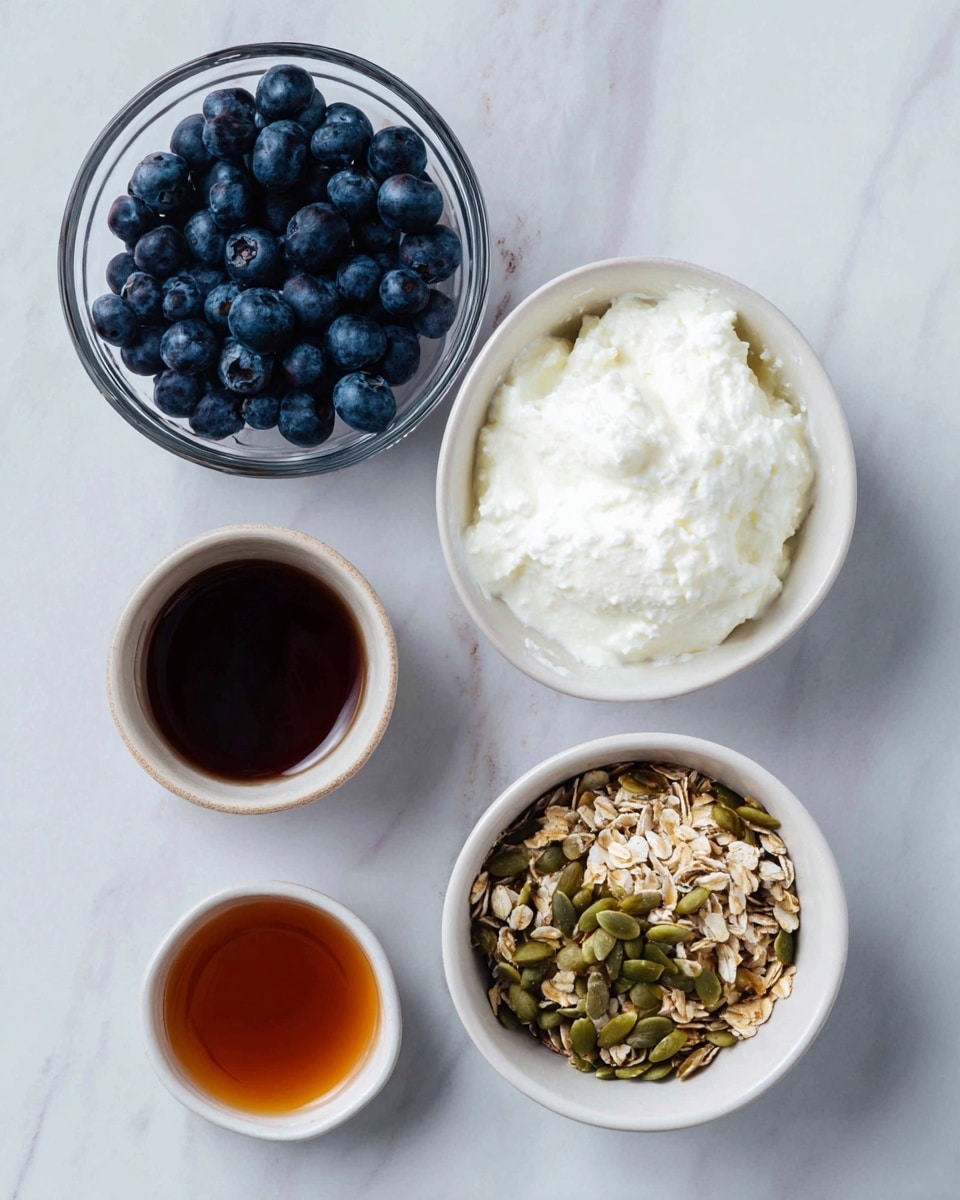 The image shows four white bowls arranged on a white marbled surface. The top right bowl contains a thick white creamy substance with a slightly textured surface. To the left, a clear glass bowl is filled with fresh, plump blueberries that are dark blue with a slight shine. Below and to the right, another white bowl holds a mix of granola with various seeds and oats, showing different shades of brown and green pumpkin seeds with a crunchy texture. At the bottom left, a small white bowl contains a dark amber liquid that looks smooth and shiny. photo taken with an iphone --ar 4:5 --v 7
