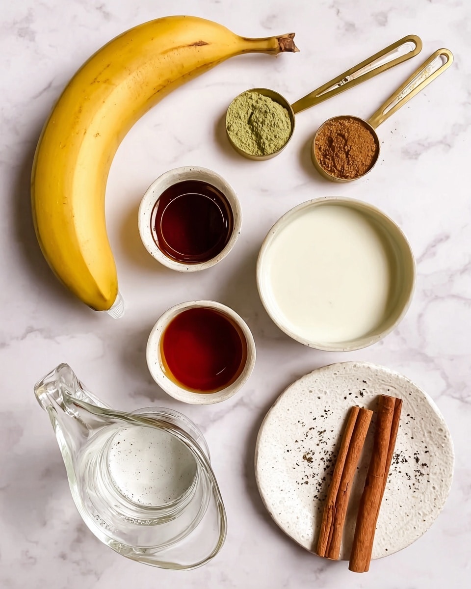The image shows a single ripe yellow banana laying diagonally on a white marbled surface. Above the banana, there are three gold measuring spoons in a row, containing a dark liquid, a green powder, and a brown powder. To the right of the spoons, there is a white bowl filled with a creamy white liquid. Below this bowl, a small white container holds a dark amber syrup. Near the bottom left side of the image, there is a clear glass pitcher with small amount of water inside. At the bottom center is a white empty bowl with tiny black specks inside it. To the bottom right, a small white textured plate holds two cinnamon sticks placed parallel to each other. All the items are spaced neatly on the white marbled surface, highlighting their colors and textures clearly. photo taken with an iphone --ar 4:5 --v 7