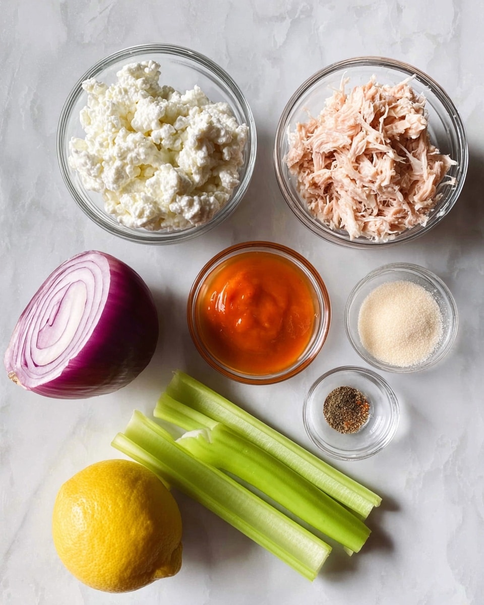 The image shows six ingredients arranged on a white marbled surface. There are two clear glass bowls, one filled with white cottage cheese that has a soft and lumpy texture, and the other with shredded light pink tuna. Another small clear glass bowl holds a small amount of bright orange hot sauce with a smooth surface. A quarter of a purple-red onion with its layers visible sits next to two bright green celery sticks with clear ribs and grooves. A whole yellow lemon with a smooth texture is placed near the center, and a tiny clear bowl contains four seasonings: white salt, black pepper, red paprika, and pale beige garlic powder. Photo taken with an iphone --ar 4:5 --v 7