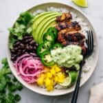 Chicken Rice Bowl with Spiced Baked Chicken, Avocado, Mango, and Cilantro Sauce Recipe