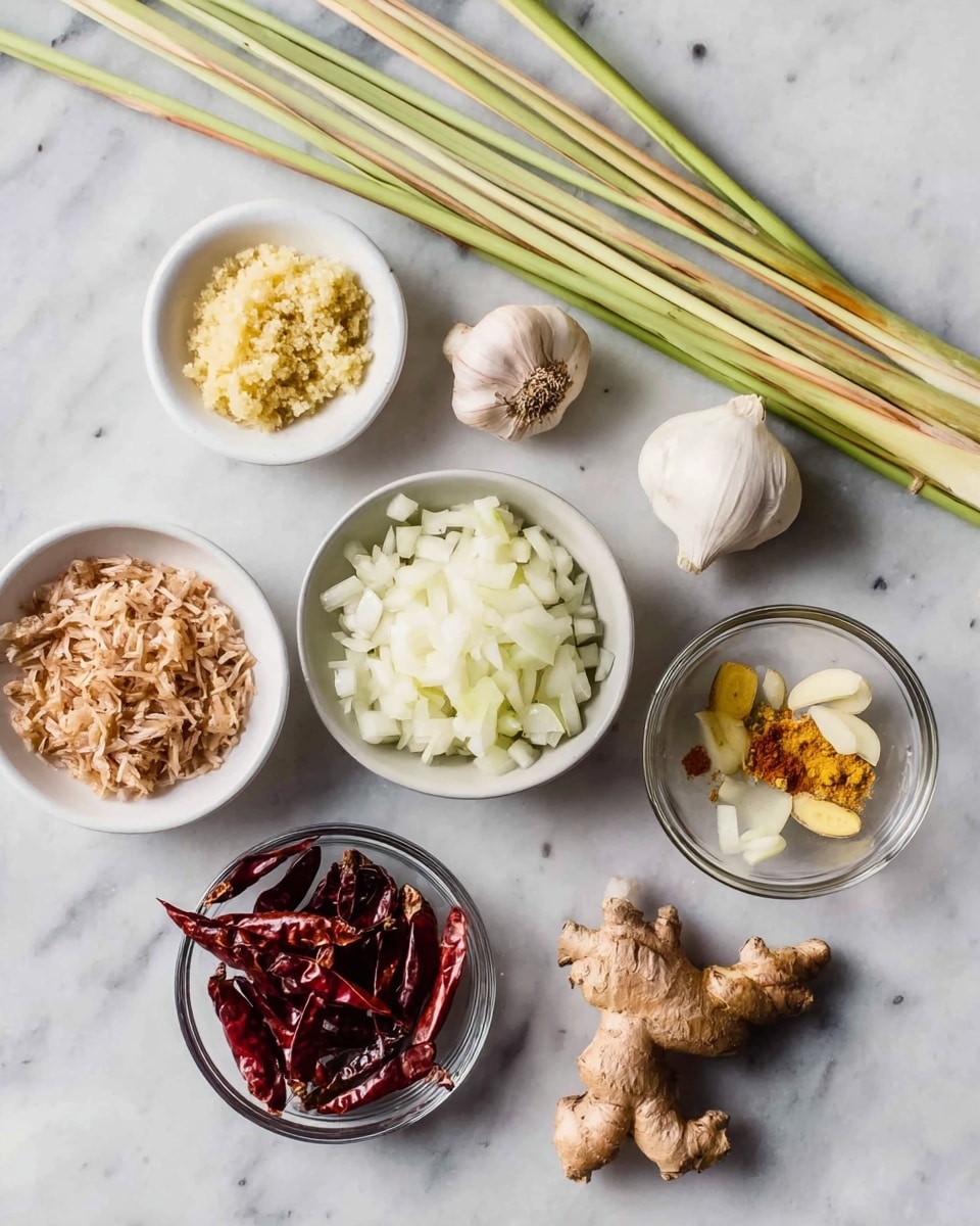 The image shows a white marbled surface with several small white and clear glass bowls arranged on it, each containing different ingredients. There are five lemongrass stalks lying horizontally near the top. From left to right, the bowls and ingredients include finely minced ginger in a small white bowl, a whole garlic bulb, a clear bowl with small dried shrimp, a larger white bowl filled with chopped white onions, a small white bowl with finely chopped ginger, and a small white bowl holding minced turmeric root along with a piece of whole turmeric. In the clear bowl near the bottom center, there are several dark red dried chilies. The textures vary from smooth chopped onions to the rough, dried look of the shrimp and chilies. The whole scene looks clean and organized, with natural colors like white, yellow, and red standing out against the white marbled background. Photo taken with an iphone --ar 4:5 --v 7