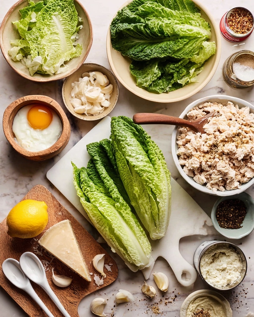 The image shows ingredients for a fresh salad arranged on a white marbled surface. At the center, there is a white cutting board with a whole head of green romaine lettuce, some leaves tightly packed and others slightly open, showing light and dark green tones. To the top right of the board, a white bowl filled with crumbled pale beige cooked chicken sits, with a raw egg yolk nearby. Above and to the left, a beige bowl holds torn romaine leaves along with two white salad serving spoons. Below the lettuce, a wooden board carries grated white cheese, a bright yellow lemon, a small bowl of ground spices, and a small bowl of black pepper. Around the setup are small bowls with garlic cloves, anchovy fillet, creamy white dressing with a brown spoon, crushed red pepper, and a tin can. The overall scene looks fresh, tidy, and ready for salad making. Photo taken with an iphone --ar 4:5 --v 7