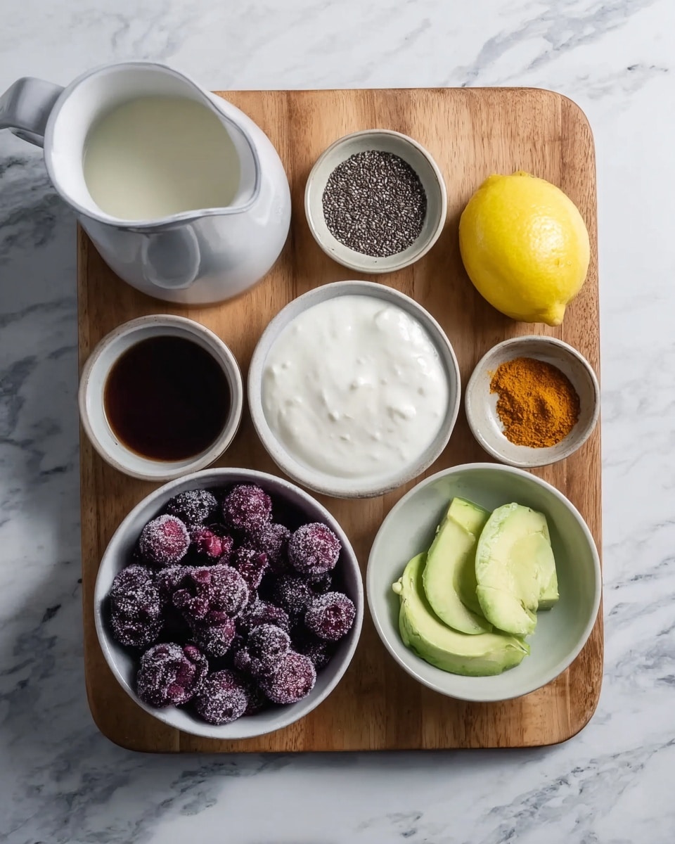 The image shows seven small white bowls and one white pitcher arranged on a wooden board on a white marbled surface. The largest bowl in the bottom left is filled with dark purple frozen berries that have a frosty texture. Next to it, on the right, is a lemon with a bright yellow peel. Above the lemon, there is a tiny bowl containing orange powder, and next to it, a bowl holds pale green frozen avocado slices with a frosty look. Centered at the top is a bowl filled with thick white yogurt that looks creamy and smooth. To its left is a small bowl with tiny black chia seeds, and a small bowl containing a dark brown liquid is placed above that. To the leftmost side of the board is a big white pitcher filled with white liquid. photo taken with an iphone --ar 4:5 --v 7