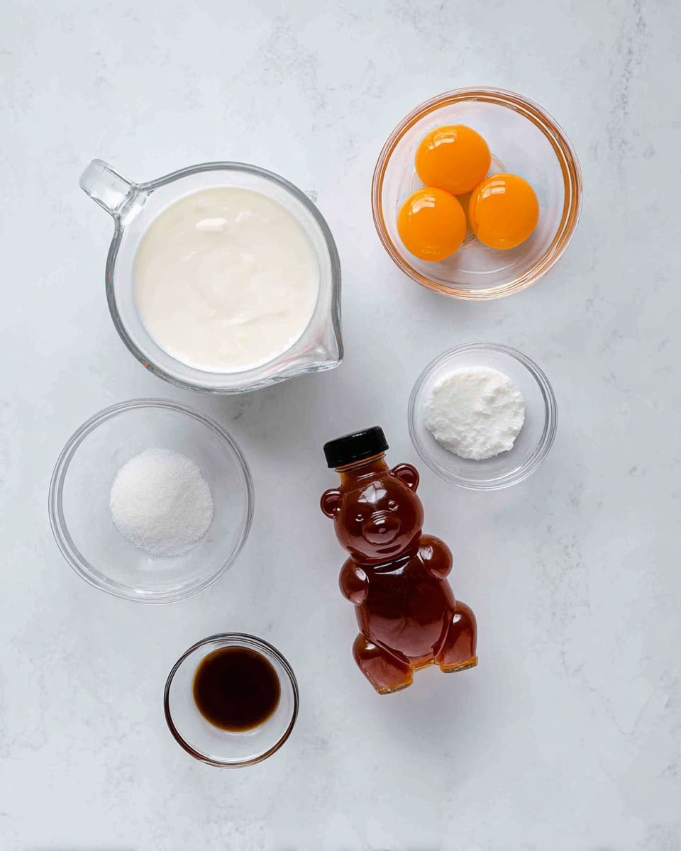 The image shows six ingredients placed on a white marbled surface: two clear glass measuring cups filled with a white creamy liquid positioned at the top left and bottom right, a small clear bowl with three bright orange egg yolks at the top right, a small clear bowl with a pinch of white salt near the left center, a small clear bowl with a dark brown liquid near the bottom left, and a bear-shaped honey bottle with a black cap lying down in the center. The setup appears neat and well-arranged, with soft lighting. Photo taken with an iphone --ar 4:5 --v 7