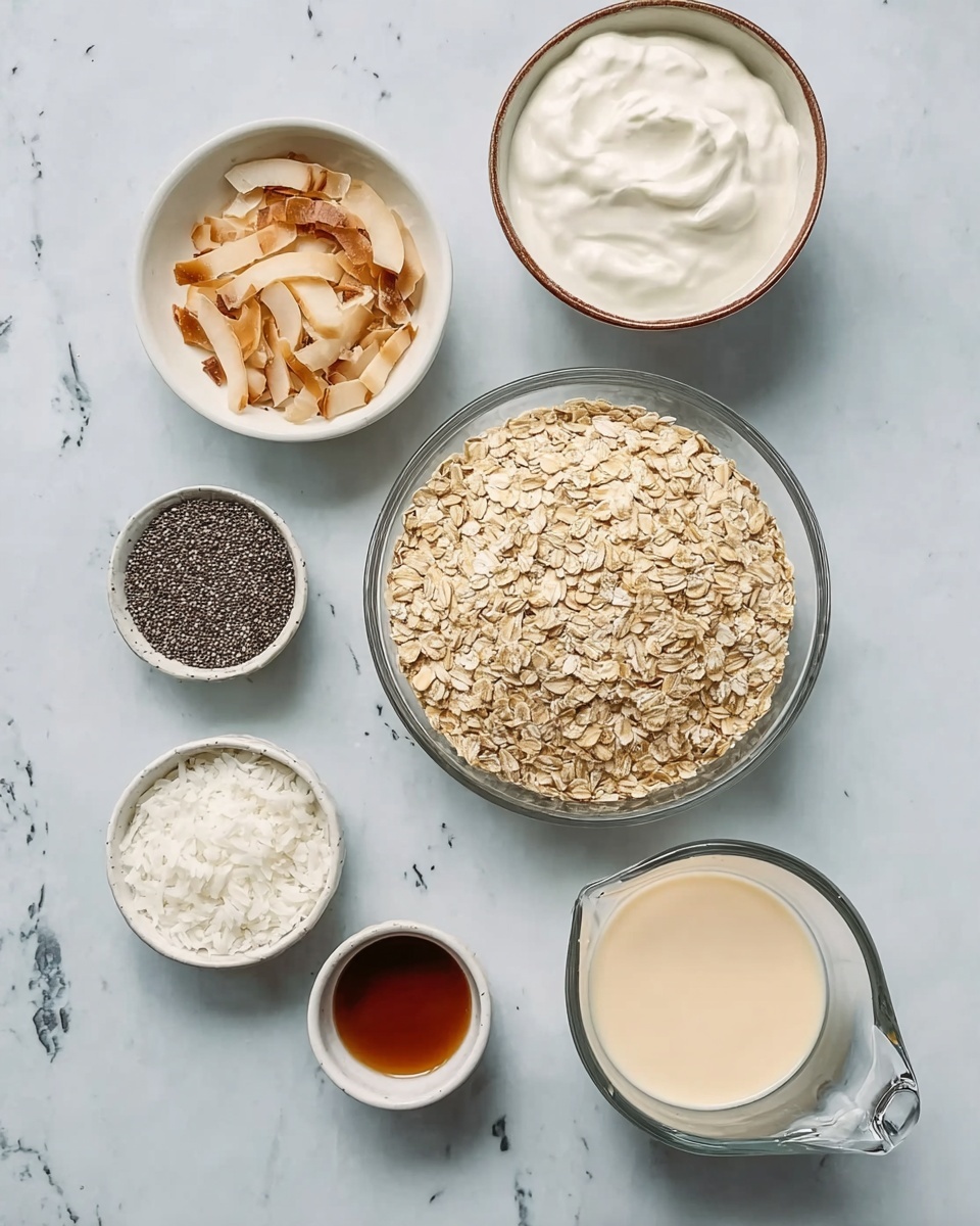 The image shows six bowls arranged on a white marbled surface. In the center, there is a clear glass bowl full of dry oats, beige and flat in texture. To the upper right, a white bowl with a brown rim contains thick, smooth white yogurt. Above the oats to the left, a small white bowl holds toasted coconut slices that are light tan with some brown edges. Below that is a small white bowl with dark brown liquid, which is smooth on top. Beneath the oats to the left, there is another small white bowl filled with small black chia seeds. Below and slightly right to the oats, a small white bowl contains white shredded coconut. To the lower right corner, a clear glass measuring cup with a handle is filled with a creamy, light beige liquid. Photo taken with an iphone --ar 4:5 --v 7