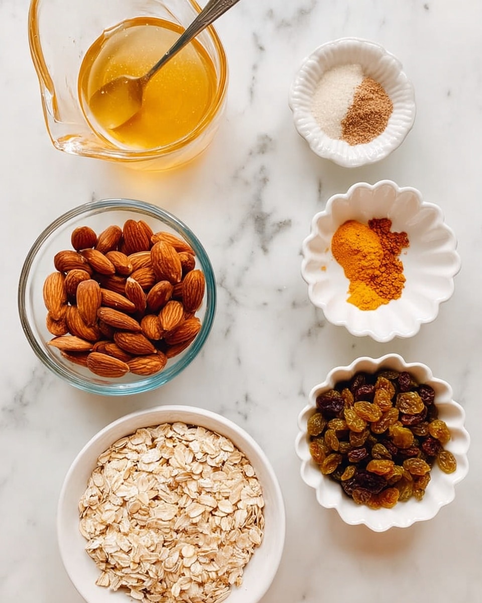 The image shows six containers of ingredients arranged on a white marbled surface. In the top left, there is a clear glass pitcher filled with golden honey and a silver spoon inside. Below it to the left is a clear glass bowl filled with whole almonds, showing their smooth brown shells. To the right of the pitcher is a small white bowl holding a mix of light beige sugar and a small amount of bright orange turmeric. Below that is a small white fluted bowl with fine brown cinnamon powder. On the bottom left, a large clear glass bowl is filled with pale beige rolled oats. To its right is a white bowl full of mixed raisins in different shades of brown and green. photo taken with an iphone --ar 4:5 --v 7