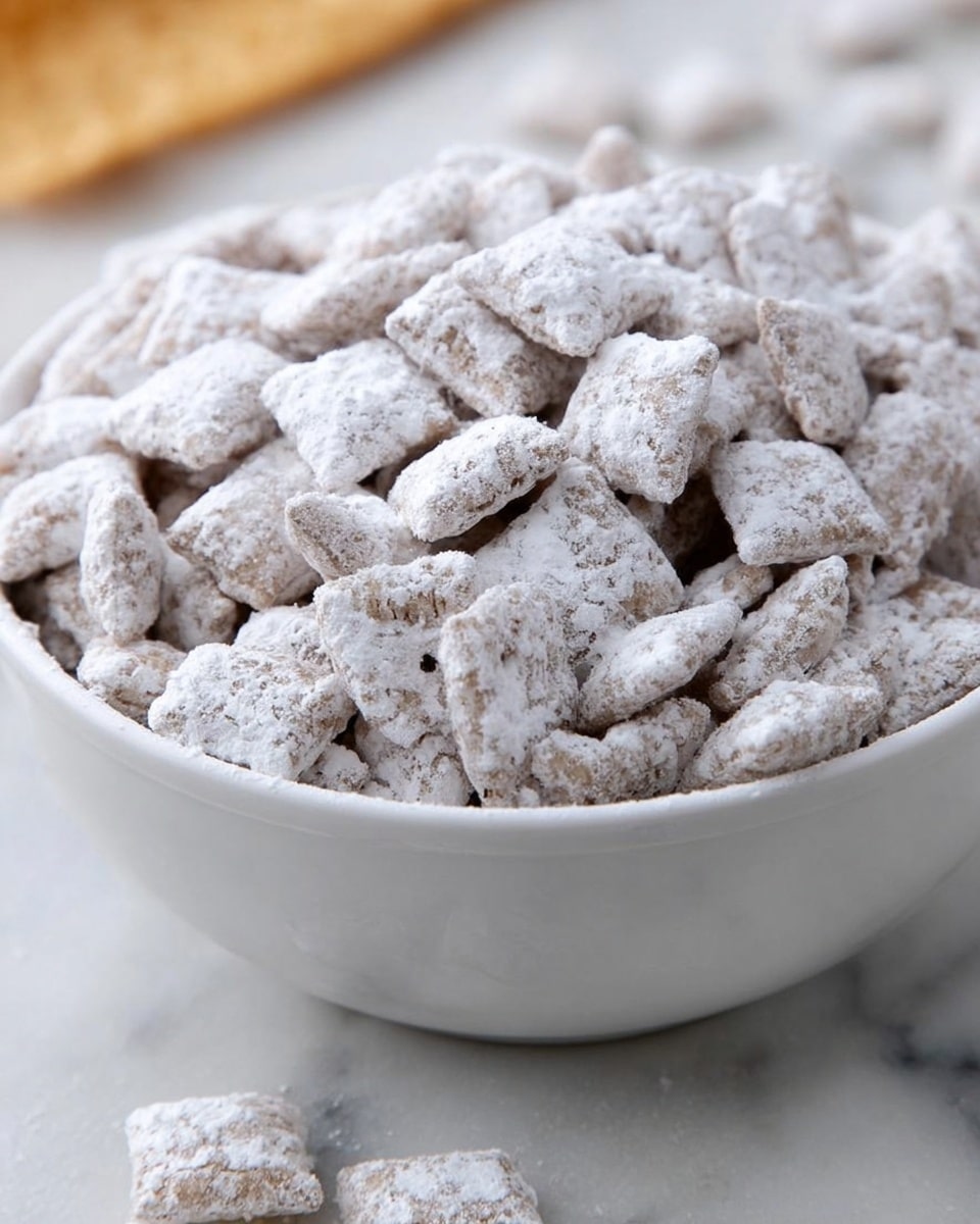 A white bowl filled with small square-shaped cereal pieces covered in a thick layer of white powdered sugar, giving them a rough and textured look. The cereal pieces have slightly visible edges and a light brown color under the sugar coating. A few cereal pieces are scattered on a white marbled surface next to the bowl. The image shows a close-up view emphasizing the powdery texture of the cereal. photo taken with an iphone --ar 4:5 --v 7