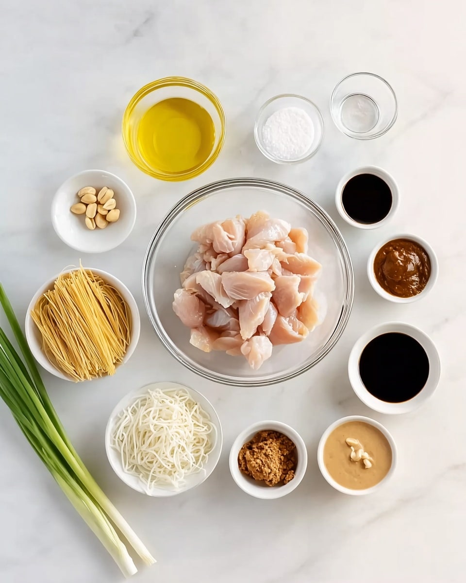 The image shows a clear glass bowl filled with raw chicken pieces in the center on a white marbled surface. Around it, there are eight small white dishes arranged, each containing different ingredients: a small bowl of yellow oil to the left, a pile of white noodles below the chicken bowl, a white dish with minced garlic below the noodles, and beside it another small dish with a brown paste. To the right of the chicken bowl, a white dish contains a light brown creamy sauce, and above it, two more bowls hold dark soy sauce and a medium brown sauce. Above these, a small white bowl with white powder and a small glass of clear liquid are placed. On the far left, three green onion stalks lay flat diagonally, and a few peanuts rest near them. The whole setup is neat, bright, and clean. Photo taken with an iphone --ar 4:5 --v 7