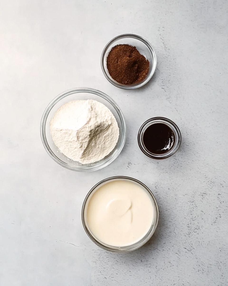 The image shows four small clear glass bowls placed on a white marbled surface, arranged in a loose triangle shape. The largest bowl at the bottom contains a creamy white liquid with a smooth texture. The bowl on the left holds a mound of white powder with a fine texture. To the top right of the powder bowl, there is a small bowl with a dark brown ground spice, finely textured. Above this brown bowl, a tiny bowl contains a dark wet paste. The overall setup is neat, with soft natural light and no shadows. photo taken with an iphone --ar 4:5 --v 7