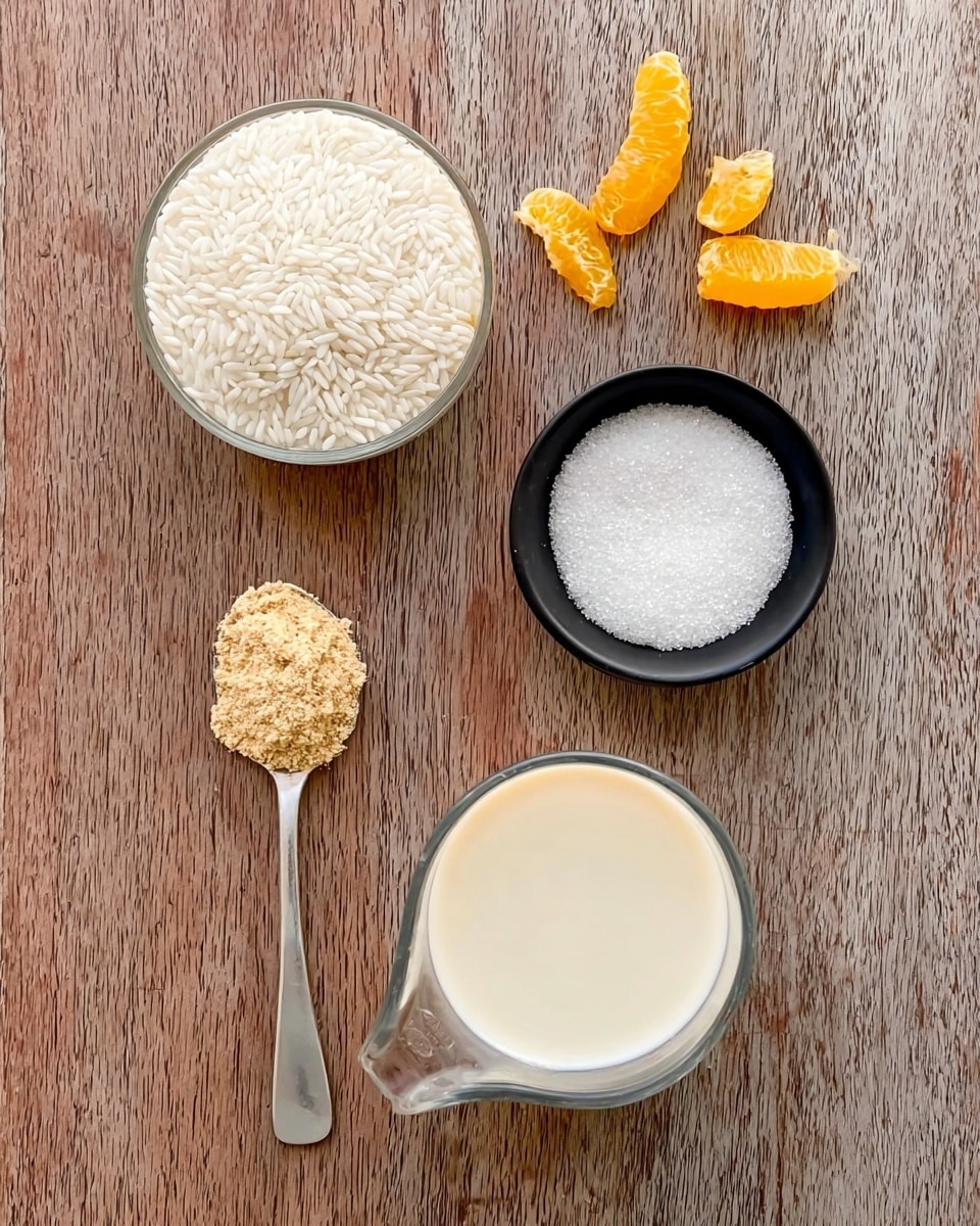 The image shows four main ingredients arranged neatly on a wooden surface: at the top left, a small clear bowl filled with white rice grains; at the top right, a small black bowl filled with white granulated sugar; below the bowls on the left, a silver spoon holding light brown powder; and below on the right, a transparent measuring cup filled with a creamy white liquid. Above the bowls are small pieces of yellow and orange citrus peels. The setting is simple and clean. photo taken with an iphone --ar 4:5 --v 7