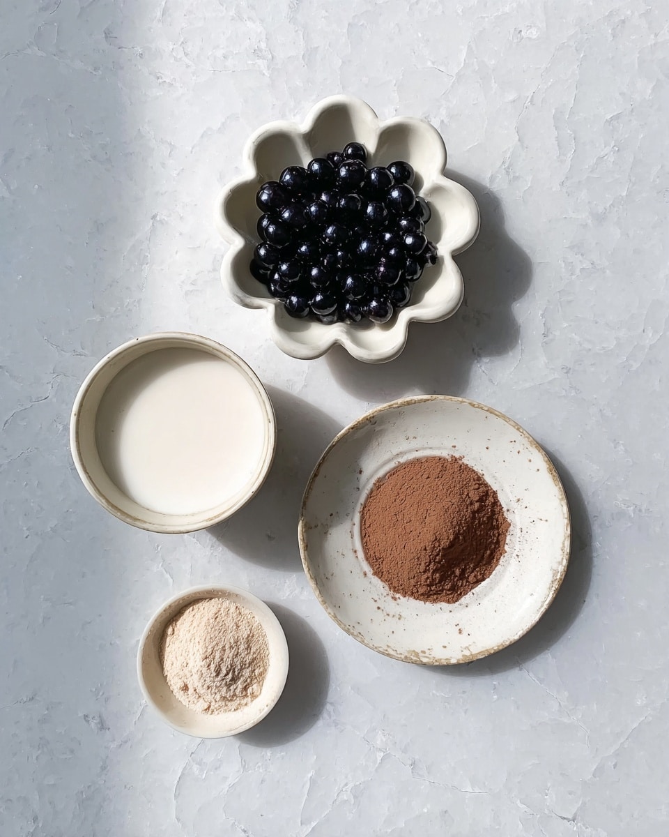 The image shows four small white dishes arranged on a white marbled surface. The top dish is flower-shaped and filled with shiny, black round pearls. Below and to the left of it is a small white bowl filled with a smooth white liquid. To the right and slightly below is a larger white plate with a ring of fine brown powder surrounding a white center. The bottom left dish, the smallest, has a light beige powder. The whole layout is viewed from above with soft natural light. photo taken with an iphone --ar 4:5 --v 7