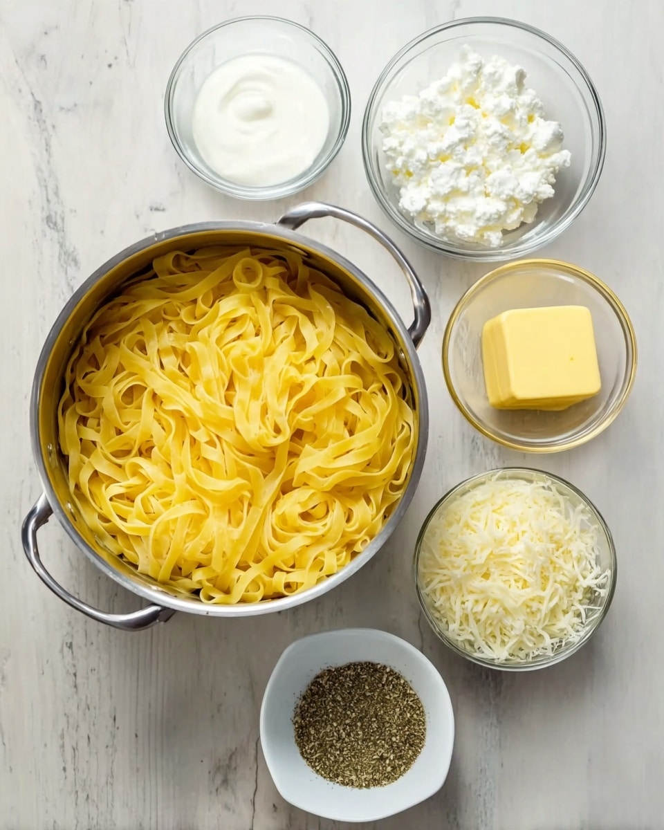 A metal pot filled with cooked yellow tagliatelle noodles sits at the center on a white marbled surface. Around the pot are five glass and white bowls: one glass bowl with white cream, one white bowl with white cottage cheese, one glass bowl with melted yellow butter, one glass bowl with finely shredded white cheese, and one white bowl holding a mixture of ground black pepper and dried herbs. The setup is simple, showing the main pasta ingredient and small bowls of sauce components arranged neatly in a semi-circle around the pot photo taken with an iphone --ar 4:5 --v 7