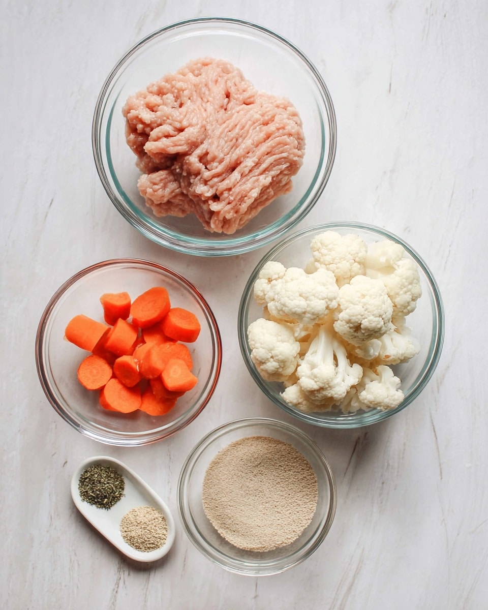 The image shows five clear glass bowls arranged on a white marbled surface. The largest bowl at the top center holds a light pink raw minced meat with a soft, ridged texture. To the right of it is a bowl filled with white cauliflower florets, showing their bumpy and irregular shapes. Below the meat bowl and slightly to the left is a smaller bowl with bright orange carrot pieces that have a smooth texture. To the lower right is a medium bowl filled with a fine, light brown powder evenly spread. At the bottom left corner is a tiny white spoon-shaped dish with three layers of herbs and powders: light beige powder, granulated beige powder, and dark green dried herbs, all set distinctly apart. The bowls and the white marbled surface create a clean and fresh setting. Photo taken with an iphone --ar 4:5 --v 7